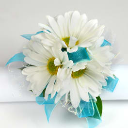 White daisy bouquet with bright blue ribbon accents