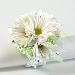 White daisy bouquet with green polka-dot ribbon