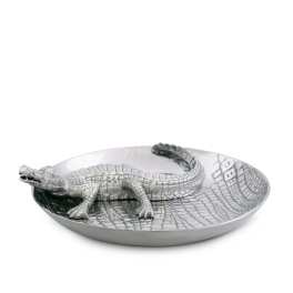 Silver crocodile figurine resting in a shallow oval dish