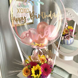 Birthday balloon with pink flowers in a striped box