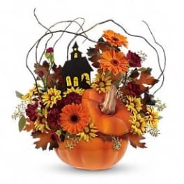 Pumpkin-shaped floral arrangement with orange and yellow flowers