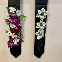 Two black graduation stoles, one with orchids and one with folded money flowers