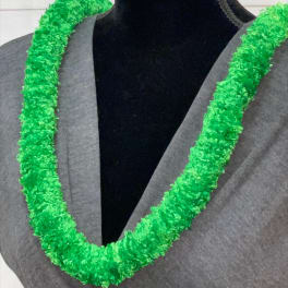 Bright green synthetic lei draped around the neck of a mannequin in a gray top