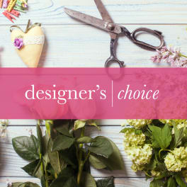 Designer’s choice text over a floral craft background with scissors and flowers