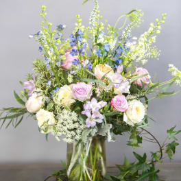 Mixed pastel bouquet in a clear glass vase