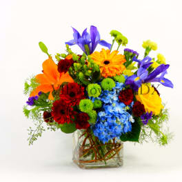 Colorful mixed bouquet in a clear glass vase