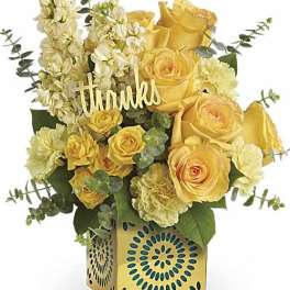 Yellow roses and cream flowers in a decorative box with a "thanks" sign