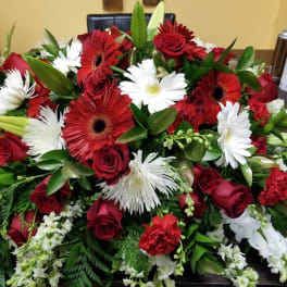 Large bouquet of red roses, red gerbera daisies, and white daisies