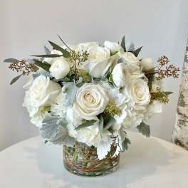White rose bouquet in a clear glass vase