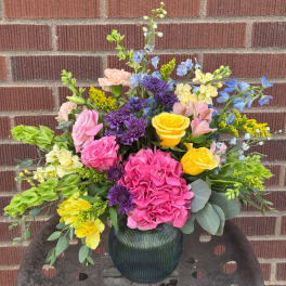 Colorful mixed bouquet in a ribbed glass vase