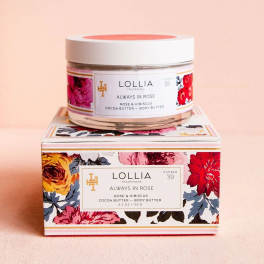 Jar of rose body butter on a floral-patterned box