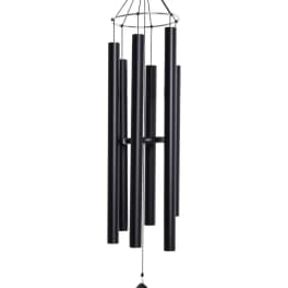 Tall black metal wind chime with multiple tubular chimes hanging in a cluster