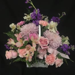 Pink and purple mixed flower basket with roses and chrysanthemums