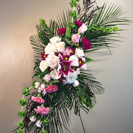Standing floral spray with pink and white roses and lilies