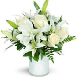 White lilies and roses in a white vase