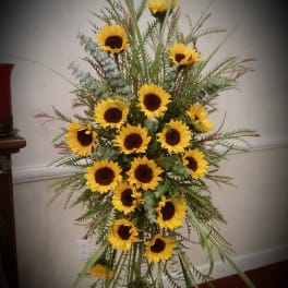 Tall sunflower arrangement with yellow blooms and mixed greenery