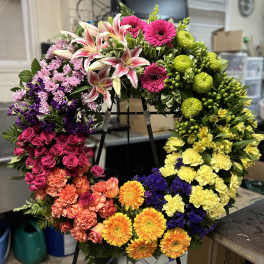 Large circular wreath of mixed flowers on a stand