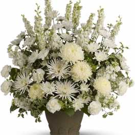 White floral arrangement in a brown vase