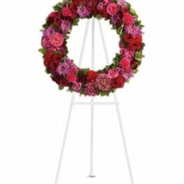 Circular floral wreath on a standing easel