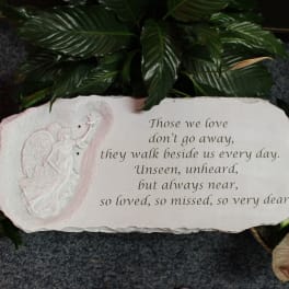 Memorial plaque with an angel relief and engraved sympathy verse