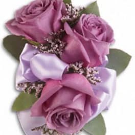 Lavender rose boutonniere with ribbon and small filler flowers