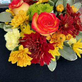 Mixed bouquet with red and yellow roses and chrysanthemums