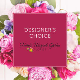 Designer’s choice floral arrangement with pink and lavender blooms