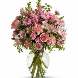 Pink mixed bouquet in a clear glass vase