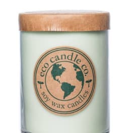 Soy wax candle in a glass jar with a wooden lid