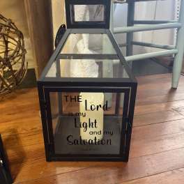 Black lantern with a candle and Psalm 27:1 text