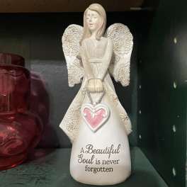 Decorative angel figurine with a pink heart and memorial text