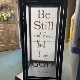 Framed sign with the words "Be Still and know that I am God"