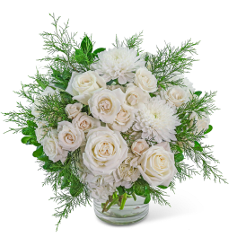 White roses and chrysanthemums in a clear glass vase