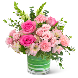 Pink roses and carnations in a green striped vase