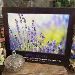 Framed lavender flower print with a glass dish in front