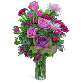 Pink and purple mixed bouquet in a clear glass vase