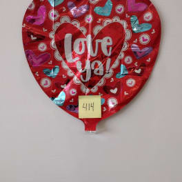 Heart-shaped red foil balloon with "Love ya!" text