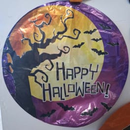 Round Halloween balloon with bats and a spooky tree, reading Happy Halloween