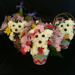Flower baskets arranged as teddy bears with colorful blooms and striped pots