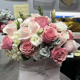 Pink and white rose bouquet in a white box with a rope bow