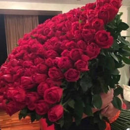 Large bouquet of red roses with dark green foliage