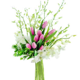 Pink tulip bouquet with white orchids and green foliage