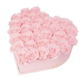 Heart-shaped box filled with pale pink roses