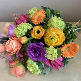 Colorful bouquet with roses, gerbera daisies, and hydrangeas