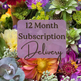 Colorful mixed flowers with a "12 Month Subscription Delivery" sign