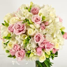 Bouquet of pink and white roses with white orchids