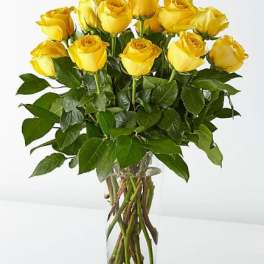 Bouquet of yellow roses in a clear glass vase