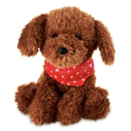 Brown plush dog with a red heart-pattern bandana