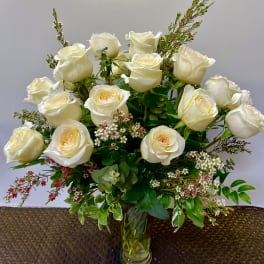 Bouquet of white roses in a clear glass vase