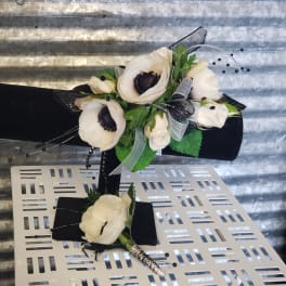 White anemone bouquet with black ribbon and silver accents